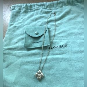 Vintage Tiffany and Co. Silver Paloma Picasso hammered flower pendant.